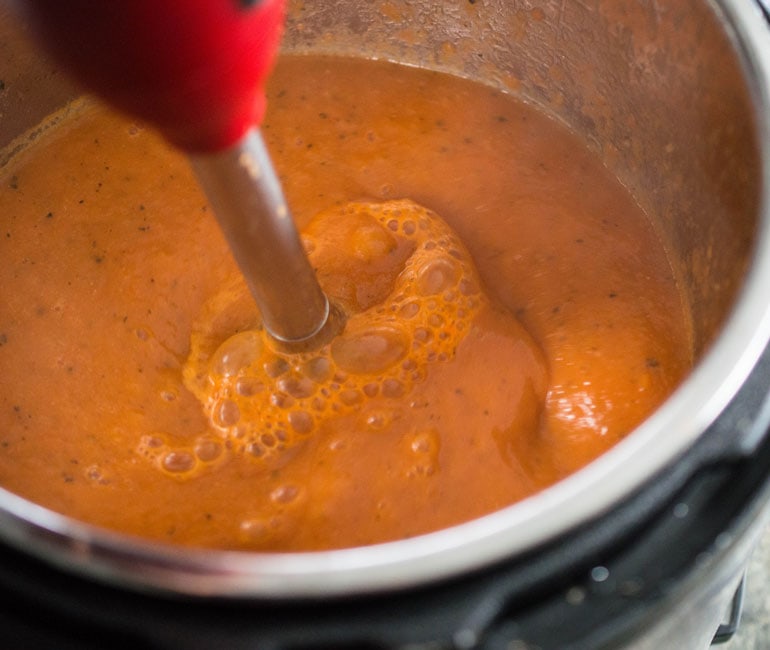 Use an immersion blender to puree this Instant Pot tomato soup.