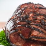 maple Glazed Ham spiral cut cooked in an electric roatser oven Vertical