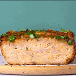 pinterest button of the inside of cooked chicken meatloaf with ground meat