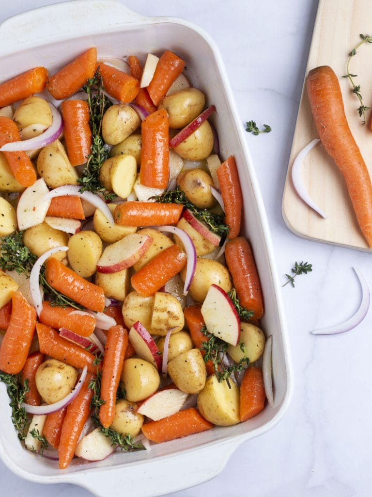 baking dish with carrots, potatoes and onions